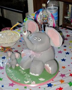 Photo of a birthday cake shaped like an elephant, with trifle on the table. #MummyMonday Sharing a Birthday Party with my Daughter SpookyMrsGreen.com mindful parenting and modern pagan lifestyle blog.
