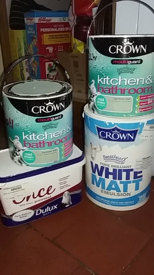 Image of Crown paint tins and Dulux white emulsion paint. My Home Renovation Kitchen Update Paint from Community Repaint repurposed tins of pain by Catherine Green of SpookyMrsGreen.com mindful parenting and modern pagan lifestyle blog.