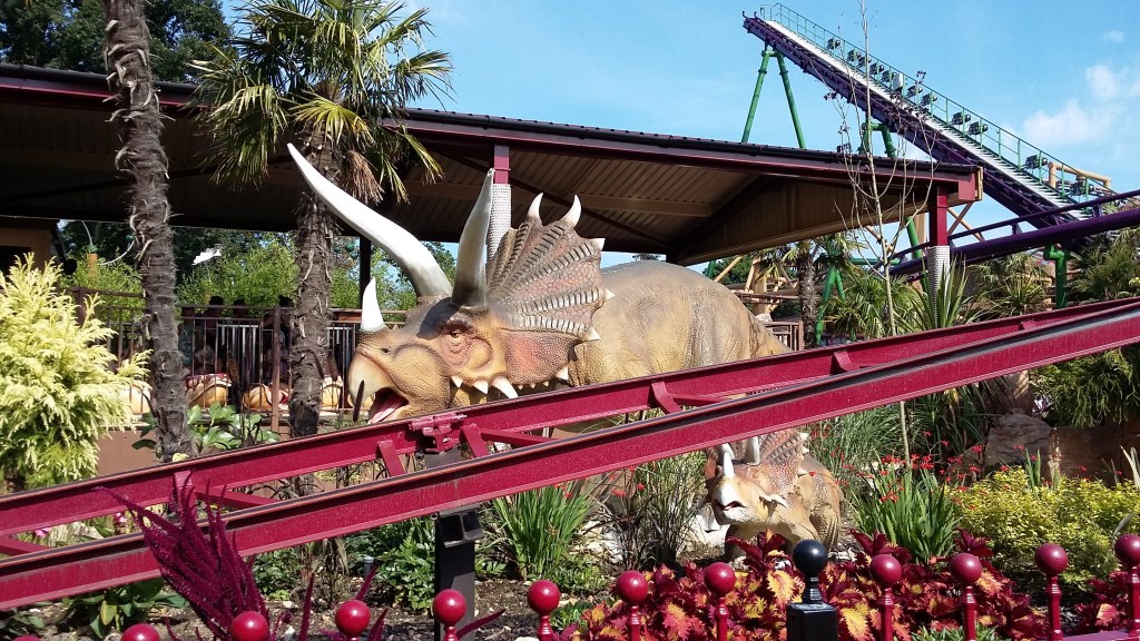 Image of an animatronic dinosaur in a theme park. Lostworld at Paulton's Park on a beautiful summer's day. SpookyMrsGreen.com mindful parenting and modern pagan lifestyle blog.