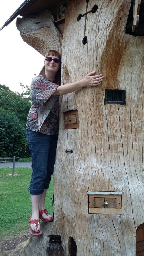 LGBT fantasy book writer Catherine Green hugging the Tree of Imagination at SpookyMrsGreen.com mindful parenting and modern pagan lifestyle blog.