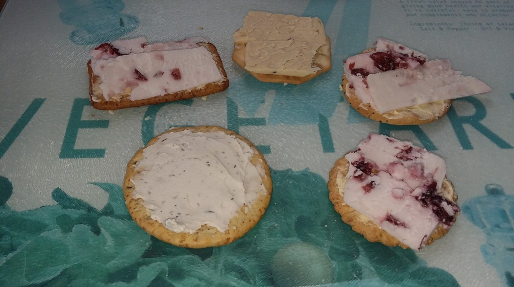 Image of cheese and crackers on a vegetarian chopping board. #ProductReview Sheese Vegan Cheese selection reviewed by Catherine Green for SpookyMrsGreen.com mindful parenting and modern pagan lifestyle blog.