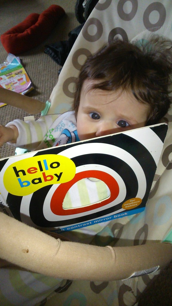 Baby loves books! #MummyMonday Photo of Georgina Green daughter of Catherine Green at SpookyMrsGreen.com mindful parenting and modern pagan lifestyle blog.