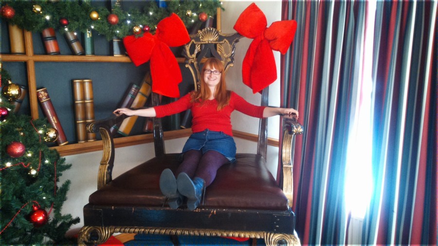 Christmas at Alton Towers Hotel. Giant chair, tiny woman! Catherine Green of SpookyMrsGreen.com mindful parenting and modern pagan lifestyle blog.