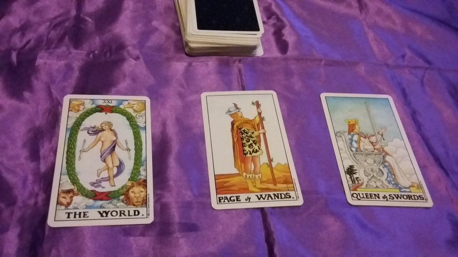 Image of Universal Ride Waite-Smith Tarot cards on a purple cloth. #365DaysofTarot Winter Tarot reading with Rider Waite-Smith Tarot card deck owned by professional Tarot reader Catherine Green of SpookyMrsGreen.com pagan lifestyle blog.