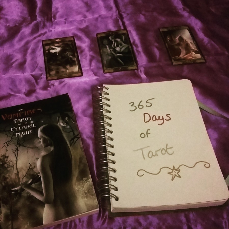 Tarot notebook and Vampires Tarot of the Eternal Night Tarot cards on a purple cloth. #365DaysofTarot Tarot reading with Vampires Tarot of the Eternal Night Tarot card deck owned by professional Tarot reader Catherine Green of SpookyMrsGreen.com pagan lifestyle blog.