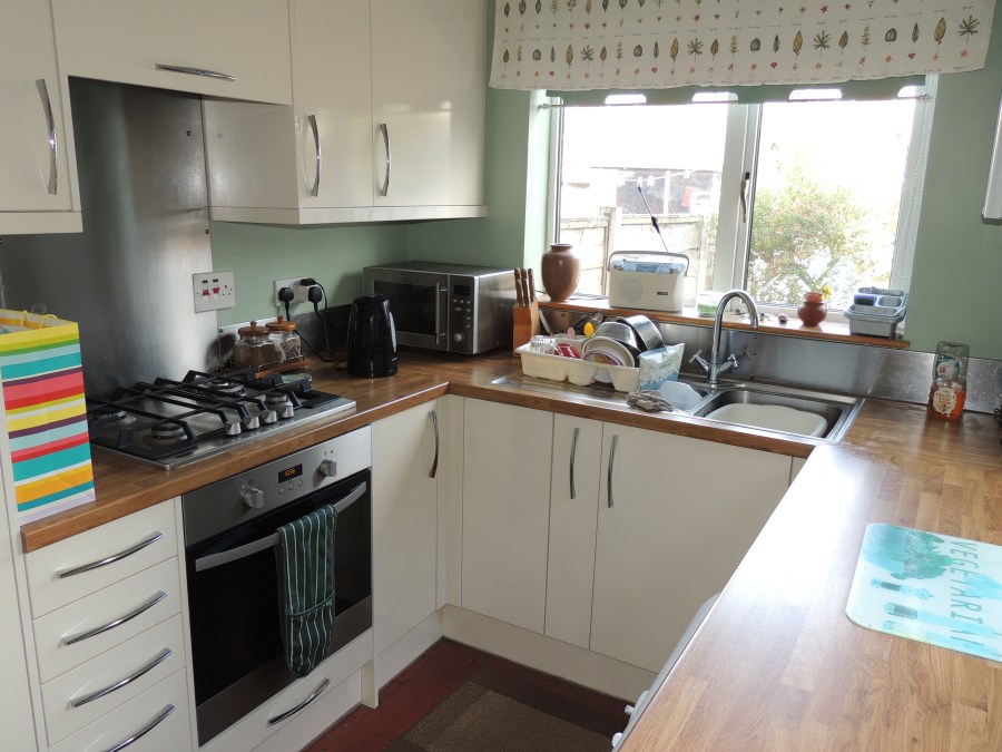 Image of a small kitchen in a Victorian terraced house in UK. My Home Renovation: White gloss fitted kitchen from Magnet at SpookyMrsGreen.com mindful parenting and modern pagan lifestyle blog.