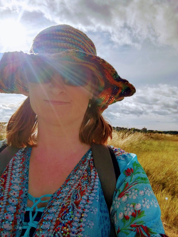 Image of LGBT fantasy book writer Catherine Green on holiday in Northumberland. SpookyMrsGreen.com mindful parenting and modern pagan lifestyle blog.