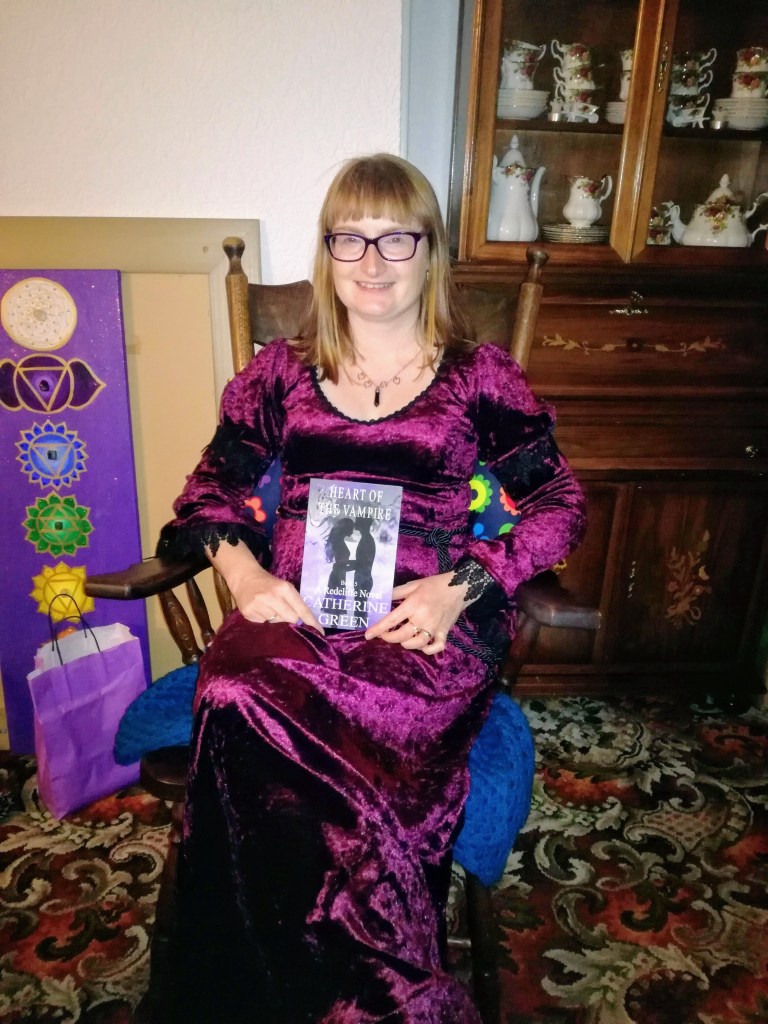#WitchyWednesday Vampire writer Catherine Green holding her new book, Heart of the Vampire (A Redcliffe Novel). SpookyMrsGreen.com mindful parenting and modern pagan lifestyle blog.