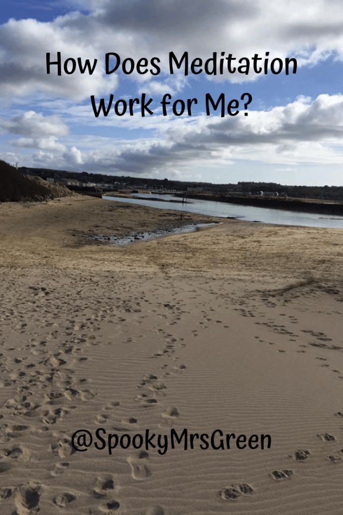 Image of a sandy beach with footprints leading to the sea, clouds in the blue sky above. Text reads "How Does Meditation Work for Me? @SpookyMrsGreen" article by Catherine Green for SpookyMrsGreen.com mindful parenting and modern pagan lifestyle blog.