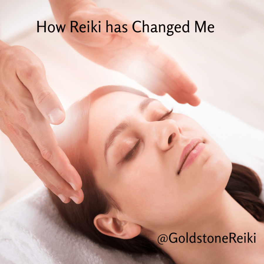 Photo of a woman receiving a reiki treatment while she lies on a therapy bed. You can see balls of white light emanating from the hands of the practitioner who is giving the reiki treatment. Text reads "How Reiki Changed Me @GoldstoneReiki"
