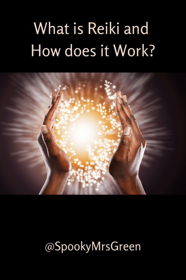 Black background, image of hands cupping a sparkling ball of yellow light to represent reiki healing energy. Text reads "What is Reiki and How does it Work? @SpookyMrsGreen."