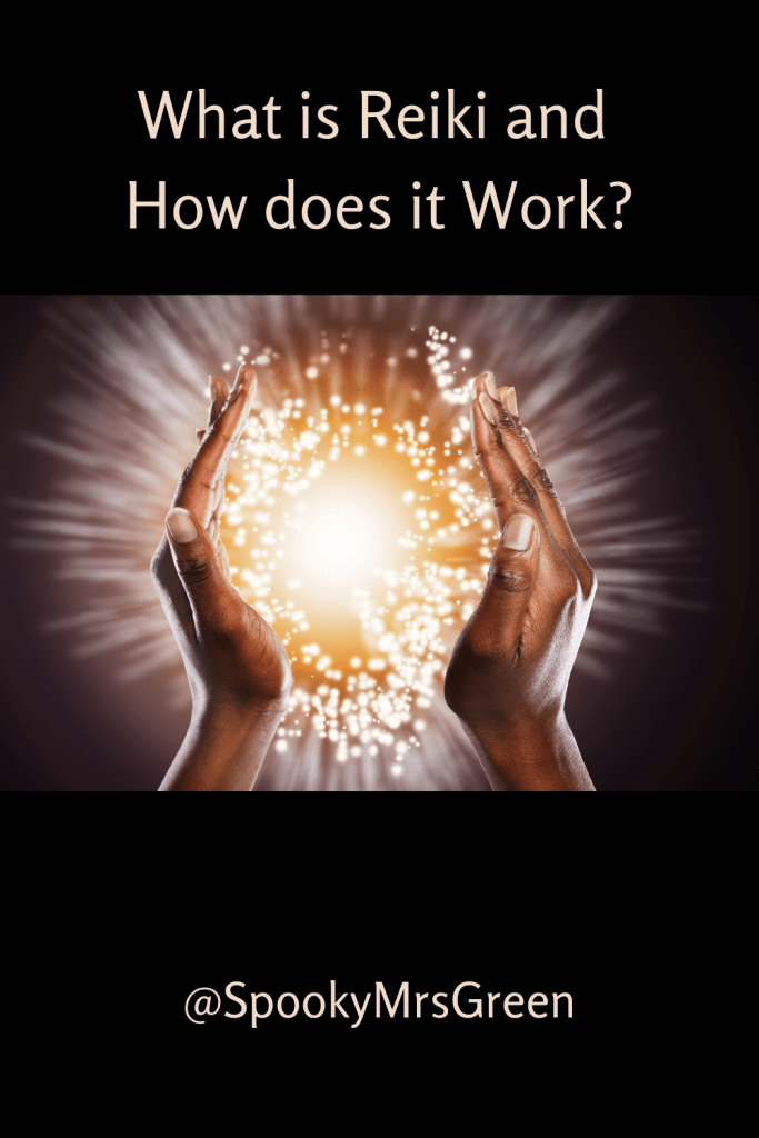 Black background, image of hands cupping a sparkling ball of yellow light to represent reiki healing energy. Text reads "What is Reiki and How does it Work? @SpookyMrsGreen."