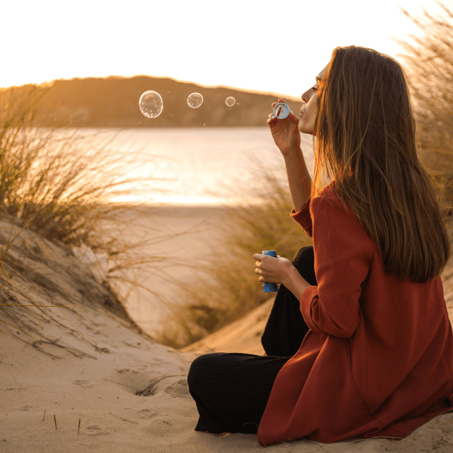 Blowing bubbles on the beach from SpookyMrsGreen.com mindful parenting and modern pagan lifestyle blog.