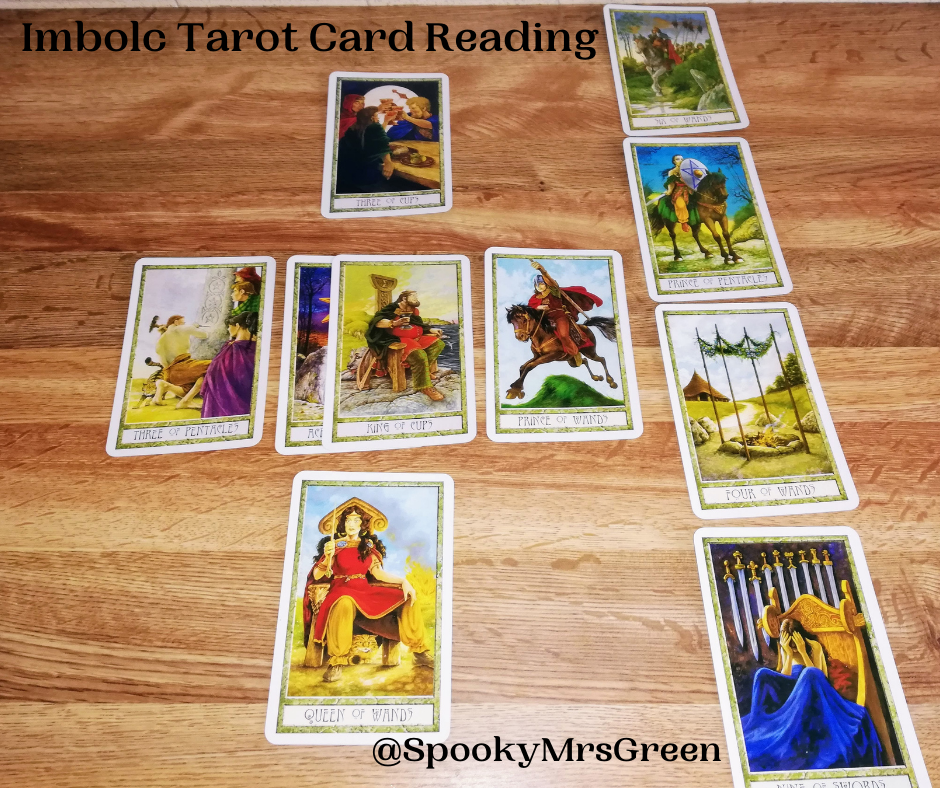 Image of Druid Craft Tarot cards on a wooden table. Text reads "Imbolc Tarot Card Reading @SpookyMrsGreen." Imbolc Tarot Card Reading by professional Tarot reader Catherine Green of SpookyMrsGreen.com pagan lifestyle blog.