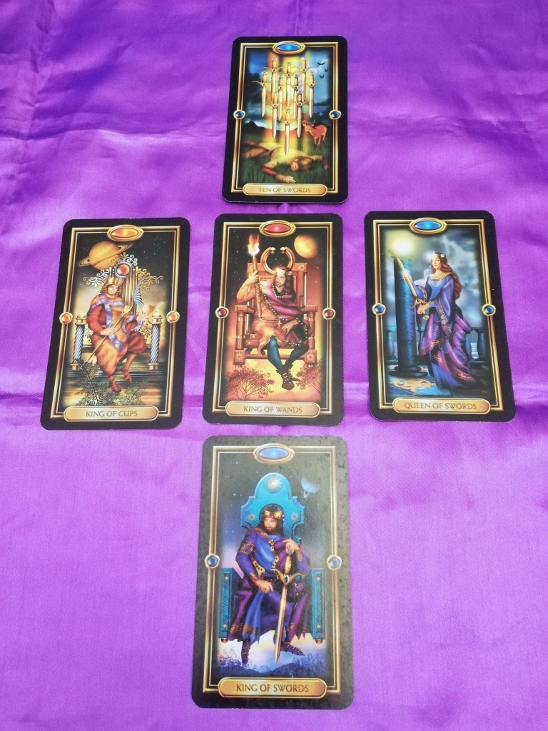 Image of Gilded Tarot cards on a purple cloth. March Tarot Reading by professional Tarot reader Catherine Green of SpookyMrsGreen.com pagan lifestyle blog.