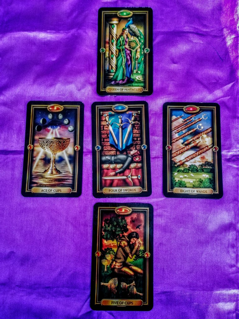 Image of Gilded Tarot cards on a purple cloth. Ostara Tarot Reading by professional Tarot reader Catherine Green of SpookyMrsGreen.com pagan lifestyle blog.