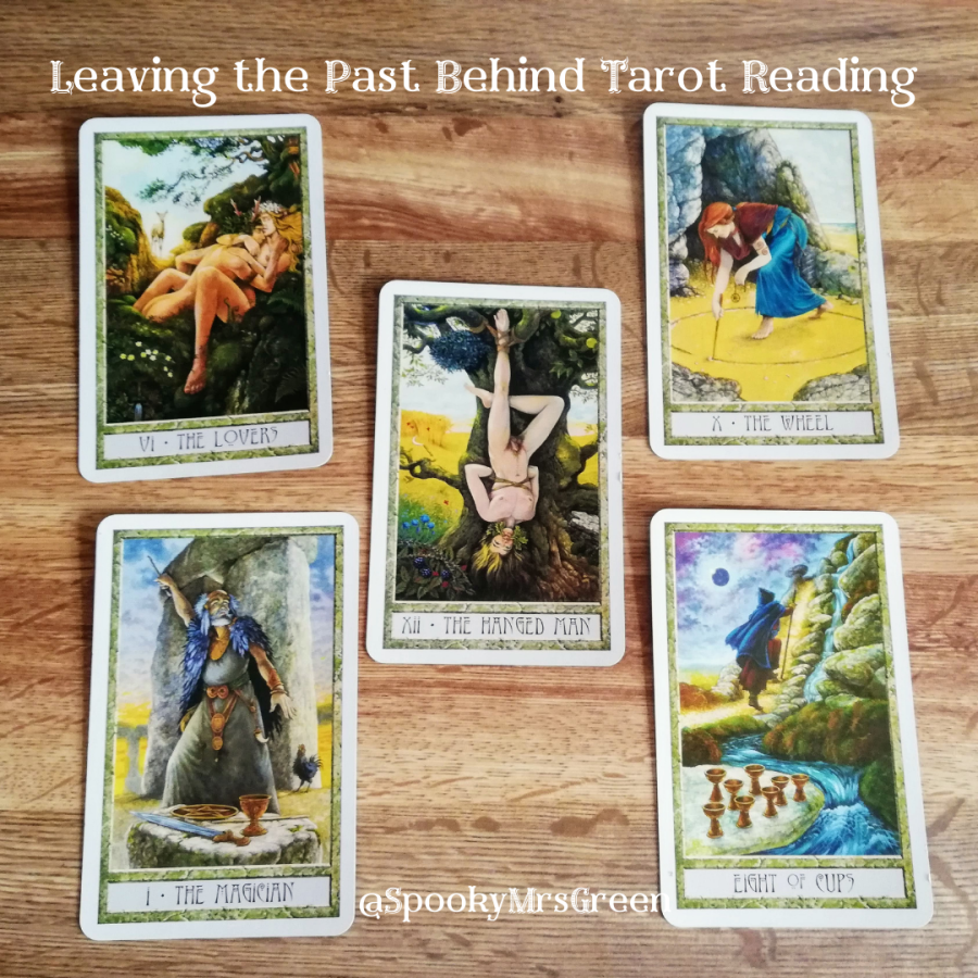 Image of Druid Craft Tarot cards on a wooden table. Text reads "Leaving the Past Behind Tarot Reading @SpookyMrsGreen." Lammas Tarot Card Reading by professional Tarot reader Catherine Green of SpookyMrsGreen.com pagan lifestyle blog.