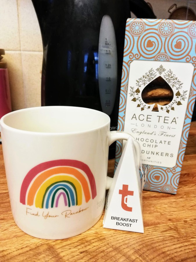 Image of Ace Tea Chocolate Chip Dunkers Cookies and Breakfast Boost Tea, and a mug with a rainbow on it. #ProductReview Gift Hampers UK reviewed by Catherine Green for SpookyMrsGreen.com mindful parenting and modern pagan lifestyle blog.