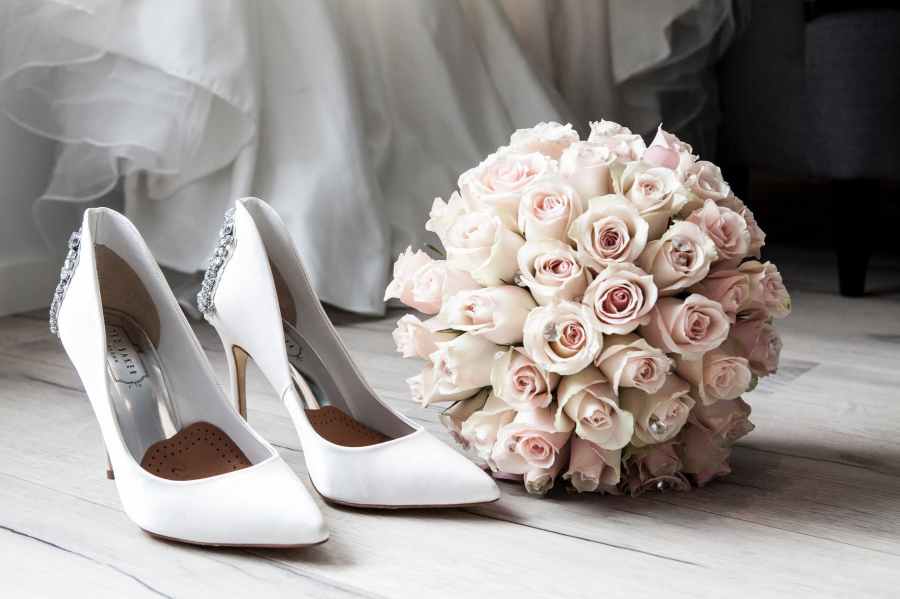White wedding shoes and wedding bouquet. Photo featured at SpookyMrsGreen.com mindful parenting and modern pagan lifestyle blog.