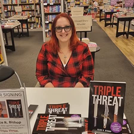 Photo of indie author Alice R Bishop with her book Triple Threat, adult suspense novel with polyamory themes. Featured at SpookyMrsGreen.com mindful parenting and modern pagan lifestyle blog.
