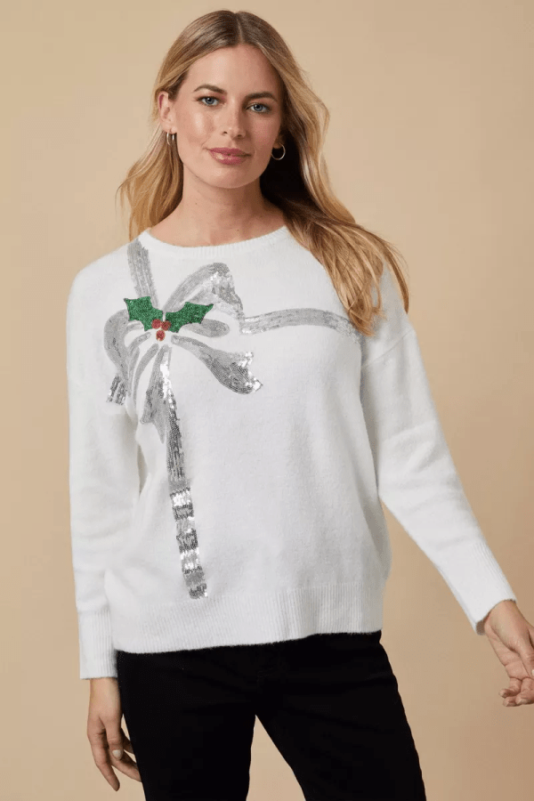 Image of woman wearing Wallis Christmas Bow Jumper. Wallis Women's Clothing, Women's Fashion, affordable fashion. Affiliated with SpookyMrsGreen.com mindful parenting and modern pagan lifestyle blog.