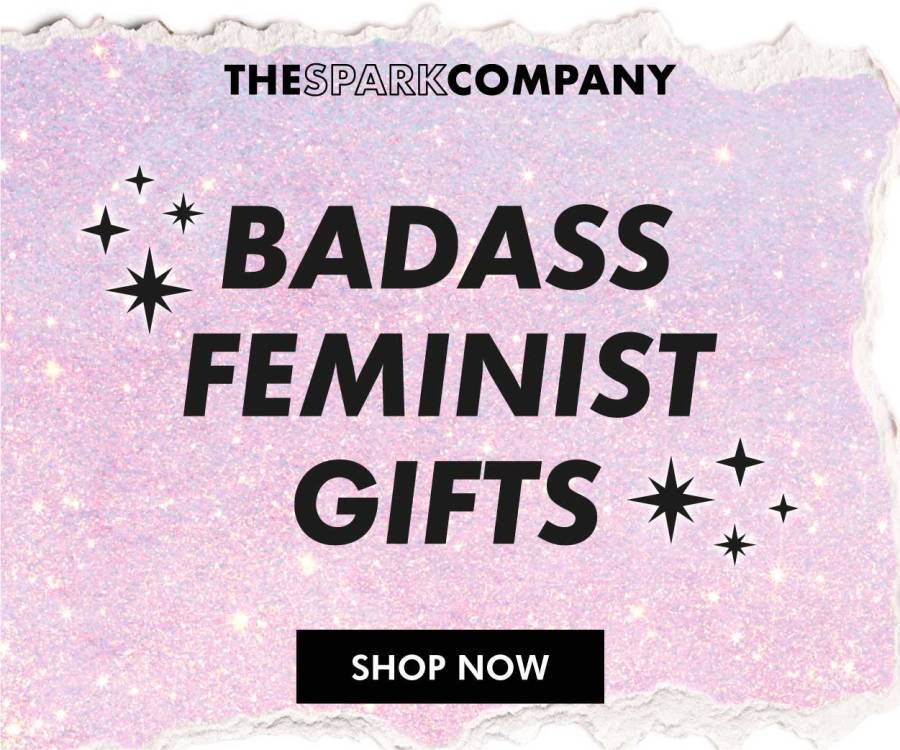 Pink glittery background with the text "Badass Feminist Gifts from The Spark Company" affiliated with SpookyMrsGreen.com pagan lifestyle blog.
