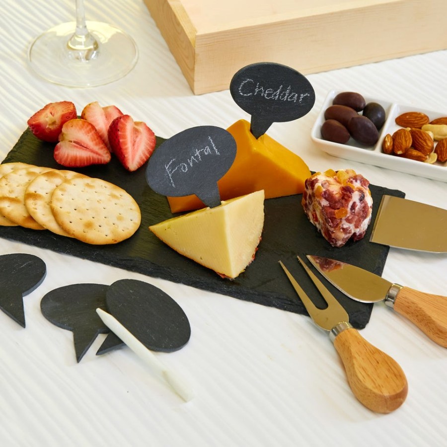 Selection of assorted Cheese on a cheeseboard with olives and a glass of wine. Chartcuterie Cheese Board Set Kikkerland. Affiliated with SpookyMrsGreen.com mindful parenting and modern pagan lifestyle blog.