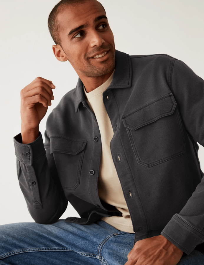Man wearing a dark grey overshirt and jeans. M&S Menswear Overshirt Offers. Affiliated with SpookyMrsGreen.com pagan lifestyle blog.