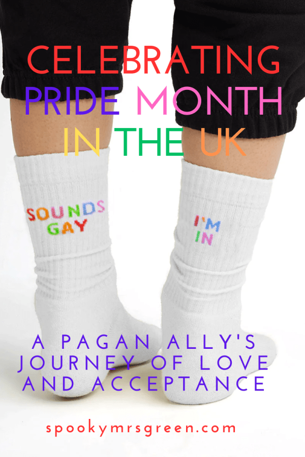 Image of a person wearing white socks that say "Sounds Gay I'm In" and the caption: "Celebrating Pride Month in the UK: A Pagan Ally's Journey of Love and Acceptance" article affiliated with The Spark Company by SpookyMrsGreen.com pagan lifestyle blog.