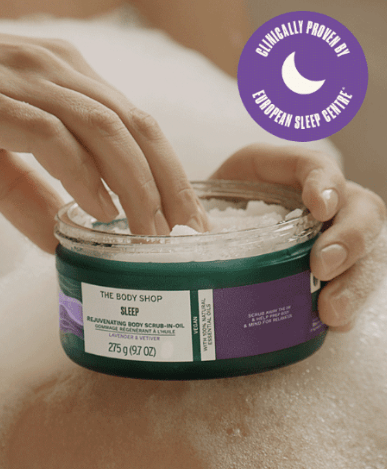 Image of someone using The Body Shop Wellness Scrub in Oil affiliated with SpookyMrsGreen.com pagan lifestyle blog.