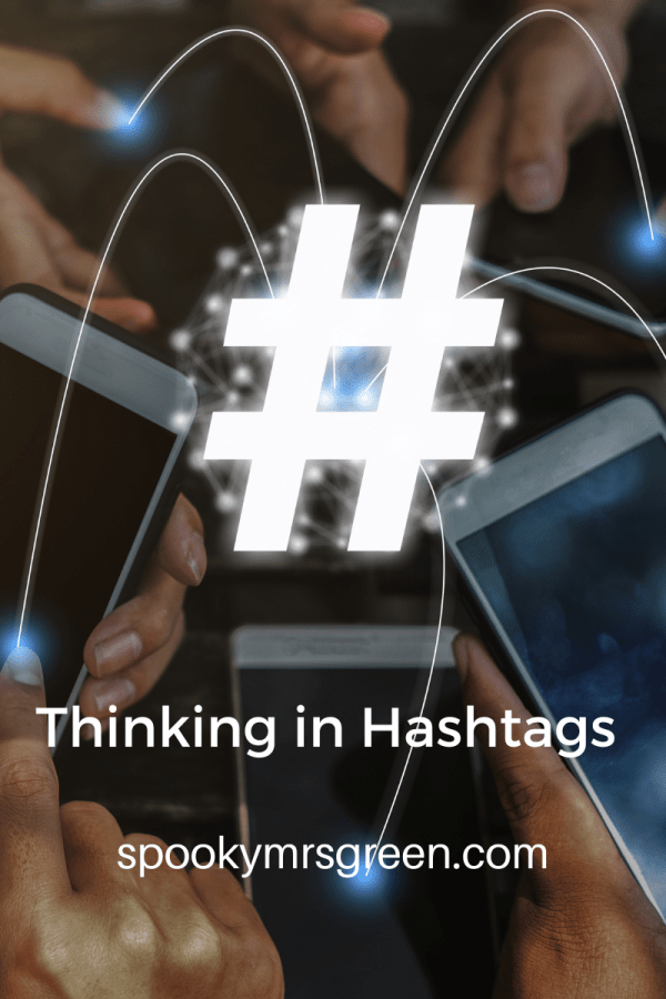 Image of a hashtag connecting a group of people via their smartphones. Article about Thinking in Hashtags by SpookyMrsGreen.com pagan lifestyle blog.