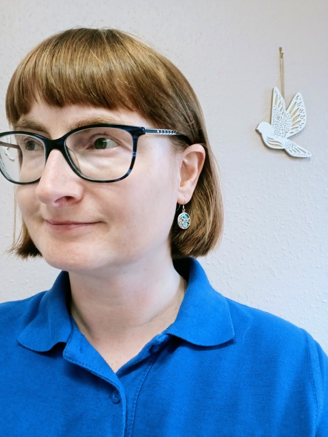 Image of LGBT fantasy book writer Catherine Green wearing The Witch Earrings from YFN Jewelry. #ProductReview YFN Fine Jewelry reviewed by Catherine Green at SpookyMrsGreen.com mindful parenting and modern pagan lifestyle blog.