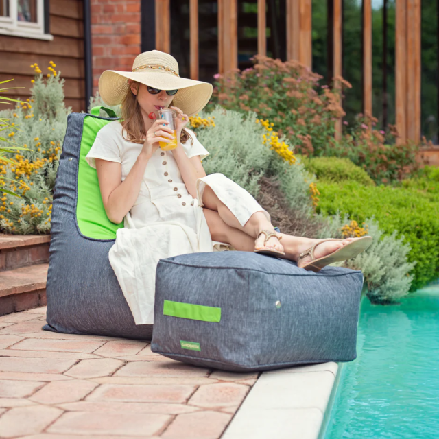 Image of a woman relaxing on an open air bean bag and footstool from Gardenista affiliated with SpookyMrsGreen.com mindful parenting and modern pagan lifestyle blog.