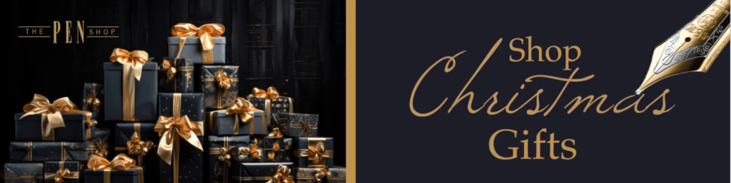 Black and gold image with a pile of wrapped gifts with gold bows and gold fountain pen nib. Text reads, “The Pen Shop. Shop Christmas Gifts.” The Pen Shop affiliated with SpookyMrsGreen.com mindful parenting and modern pagan lifestyle blog.
