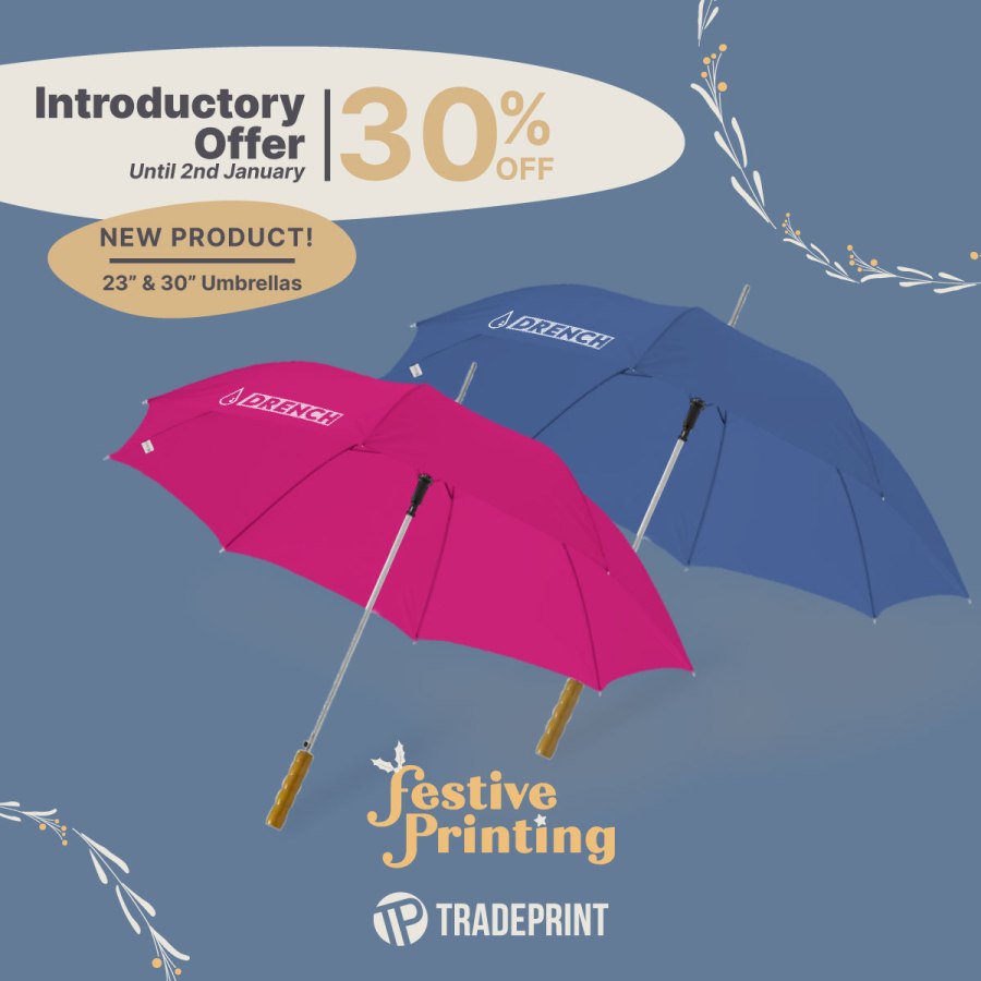 Image of a pink personalised umbrella and a blue personalised umbrella. Text reads, “Introductory offer until 2 January 30 per cent off New Product! 23 inch and 30-inch umbrellas. Festive printing. Tradeprint.” Tradeprint affiliated with SpookyMrsGreen.com mindful parenting and modern pagan lifestyle blog.
