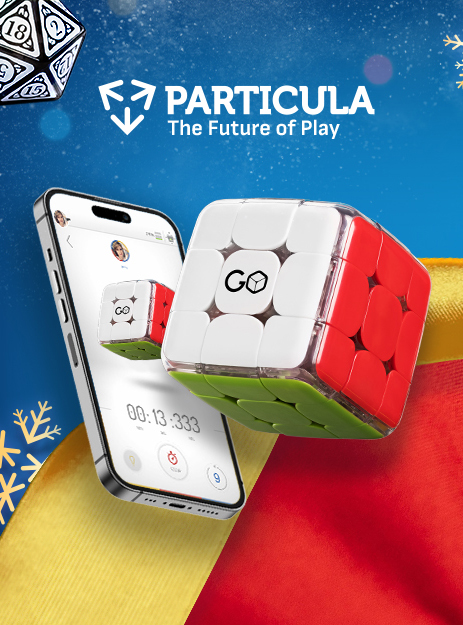 Colourful image of a dice leaping out from a phone screen. Text reads “Particula. The future of play.” Particula affiliated with SpookyMrsGreen.com mindful parenting and modern pagan lifestyle blog.