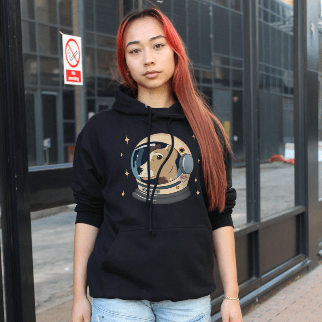 Image of a woman wearing a Space Dog Hoodie (Unisex) from Sassyspud. Ethically made, eco-friendly apparel vegan clothes affiliated with SpookyMrsGreen.com mindful parenting and modern pagan lifestyle blog.