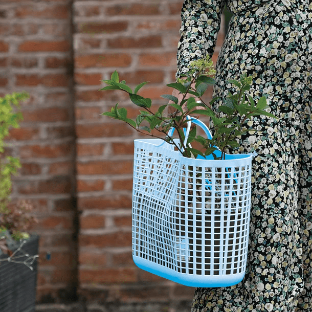 Image of a woman carrying a Cesto Shopping Tote limited edition from Red Gorilla affiliated with SpookyMrsGreen.com mindful parenting and modern pagan lifestyle blog.