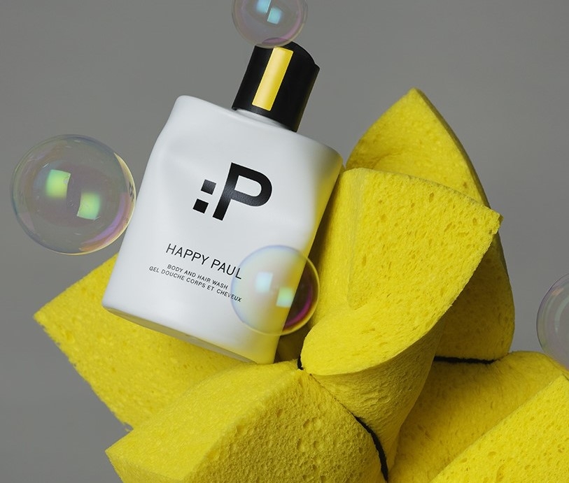 Image of Happy Paul Body Wash with yellow bath sponges and bubbles. Happy Paul UK affiliated with SpookyMrsGreen.com mindful parenting and modern pagan lifestyle blog.