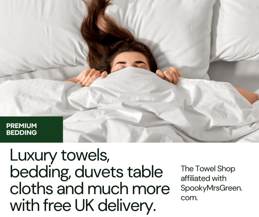 Image of a woman lying in bed under a white duvet. Text reads, “Luxury towels, bedding, duvets table cloths and much more with free UK delivery. The Towel Shop affiliated with SpookyMrsGreen.com.”