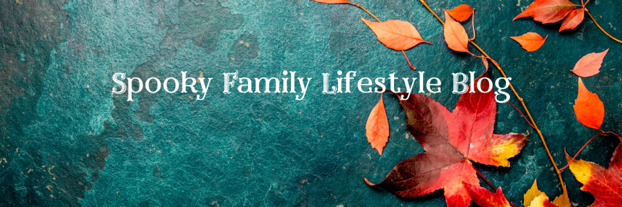 Colourful image of autumn leaves on a dark blue watery background. SpookyMrsGreen.com: Spooky family lifestyle blog.