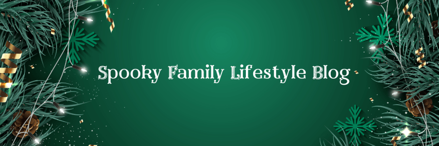 Colourful festive image with a green background, Christmas tree branches, Christmas lights and tinsel. SpookyMrsGreen.com: Spooky family lifestyle blog.