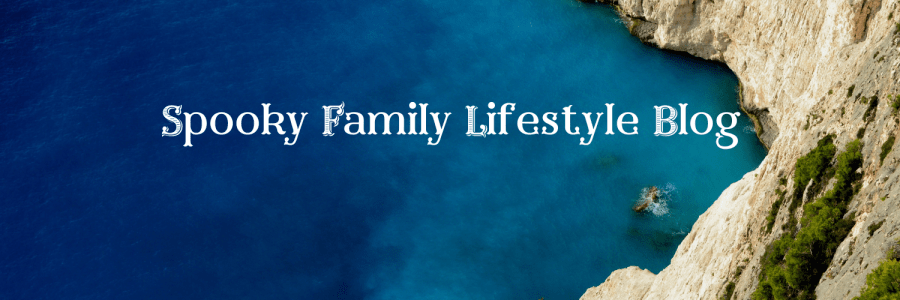Colourful summer image of blue sea and chalky cliffs in a cove. SpookyMrsGreen.com: Spooky family lifestyle blog.