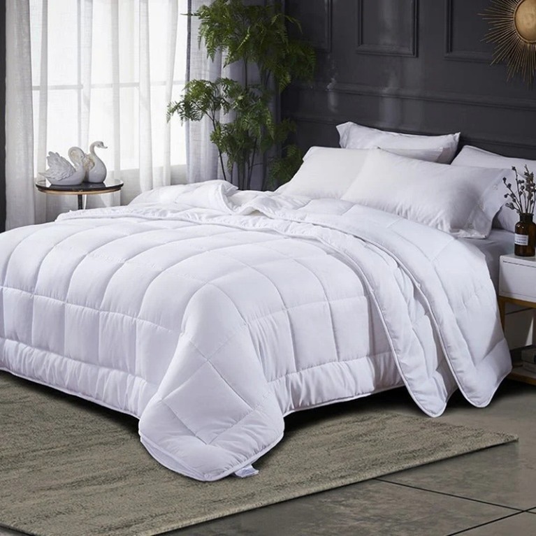 Image of a duvet and bed linen in a bedroom. You Know Who's Microfibre Supersoft Luxury 10.5 Tog Quilt