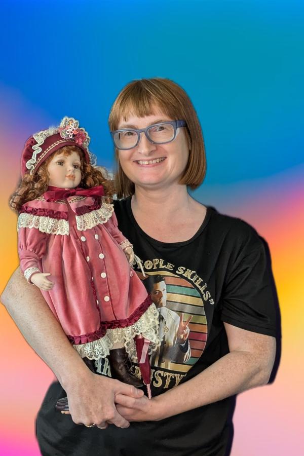 Image of paranormal author Catherine Green holding her haunted doll.