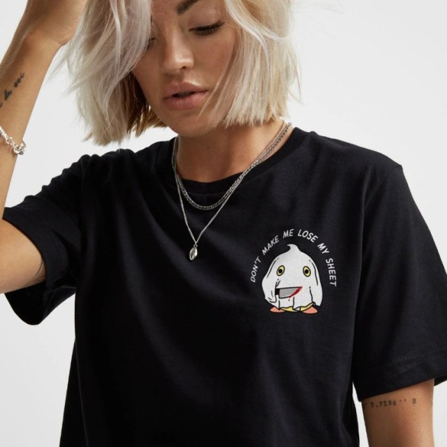 Image of a woman wearing Sassyspud LIMITED EDITION: Stabby Sheet Halloween T-Shirt with exclusive discount code affiliated with SpookyMrsGreen dot com